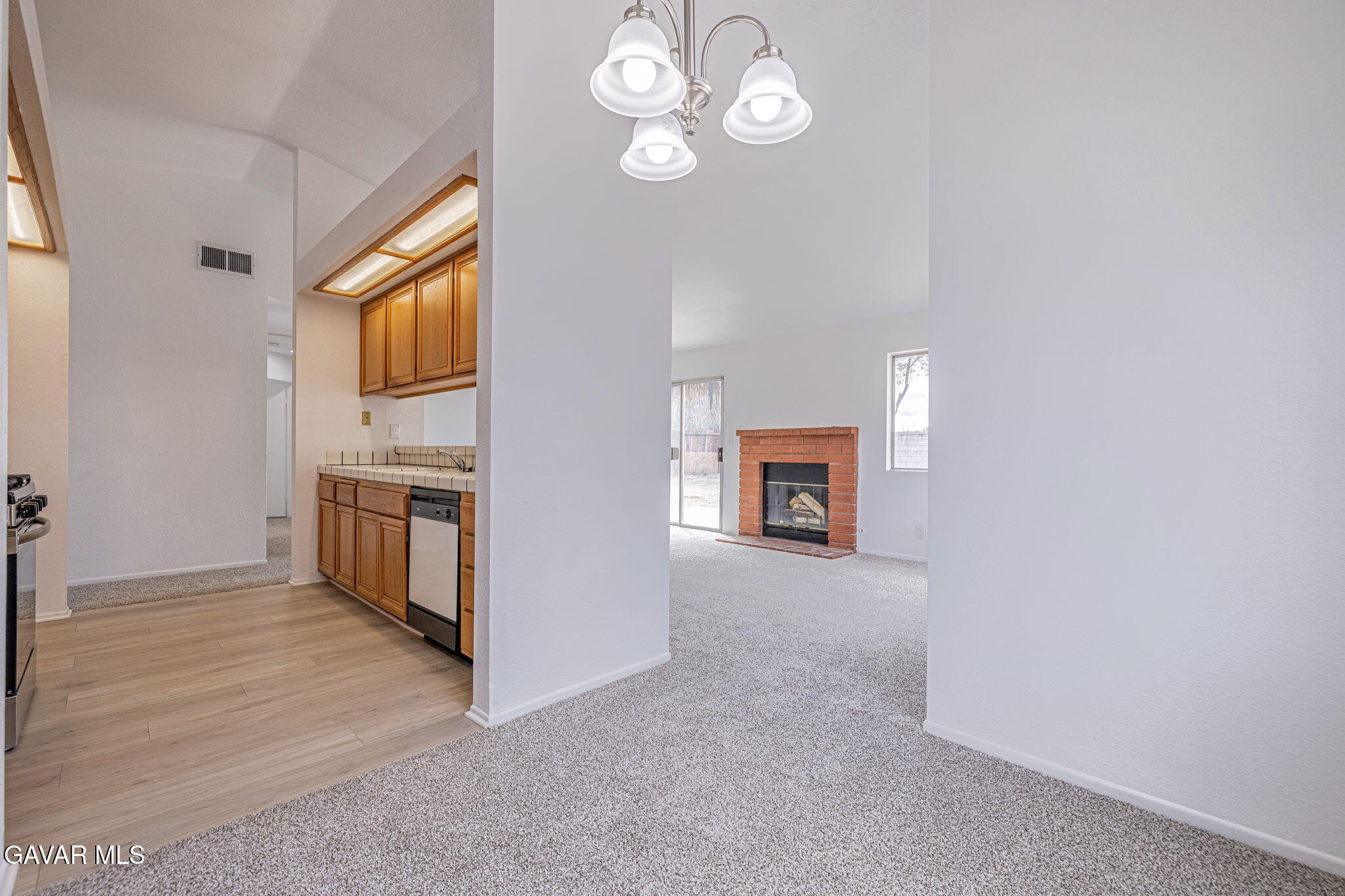2340 Lightcap Street Lancaster, CA 93535 - Photo 11 of 40 a view of a kitchen with a sink cabinets and a window