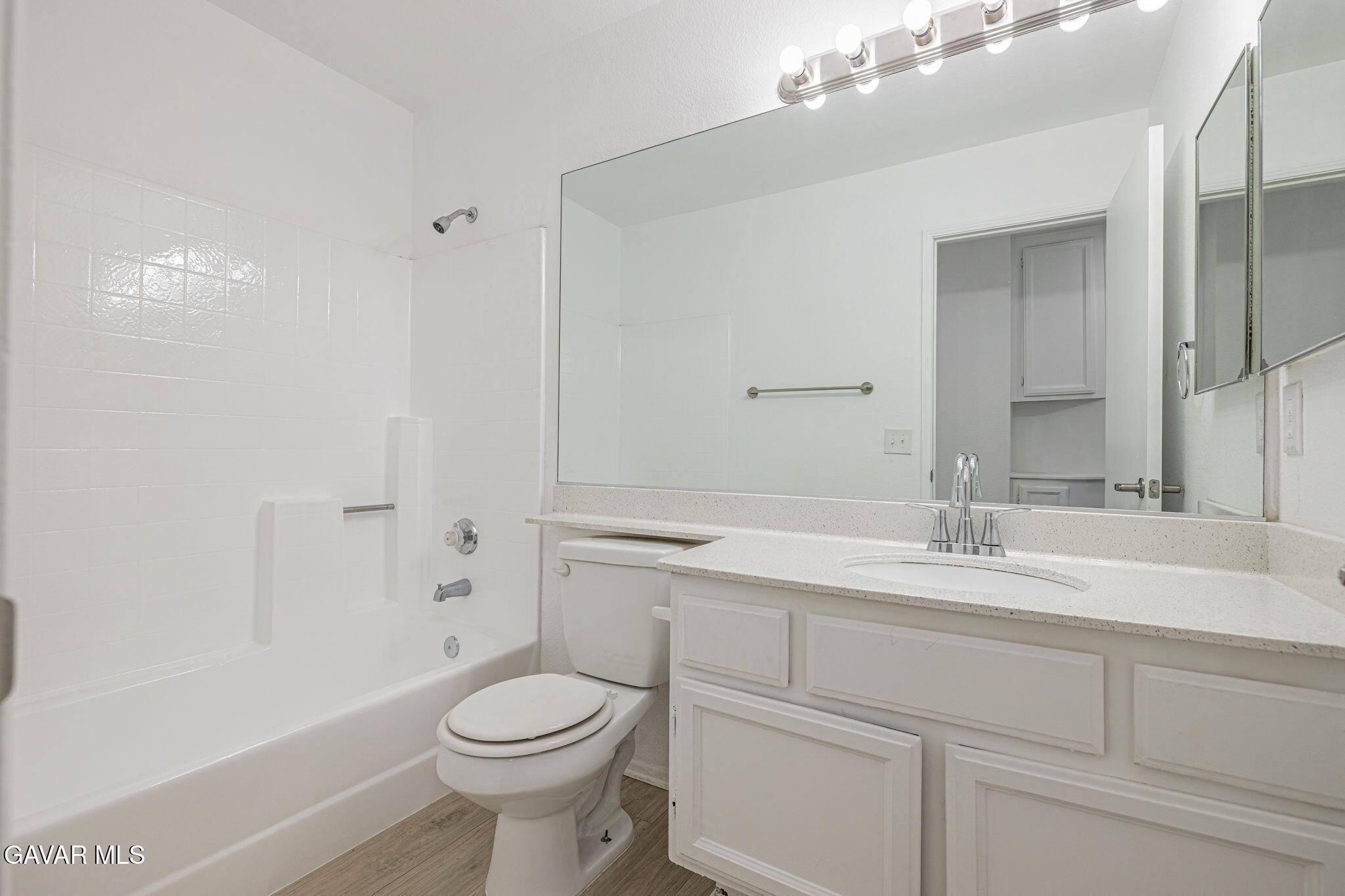 2340 Lightcap Street Lancaster, CA 93535 - Photo 19 of 40 a bathroom with a sink a toilet and shower