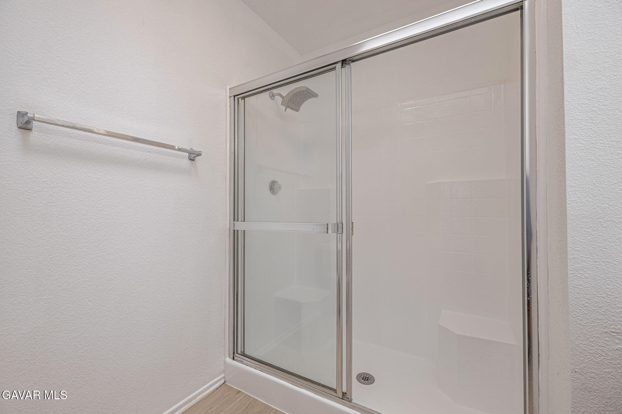 2340 Lightcap Street Lancaster, CA 93535 - Photo 24 of 40 a bathroom with a glass shower door