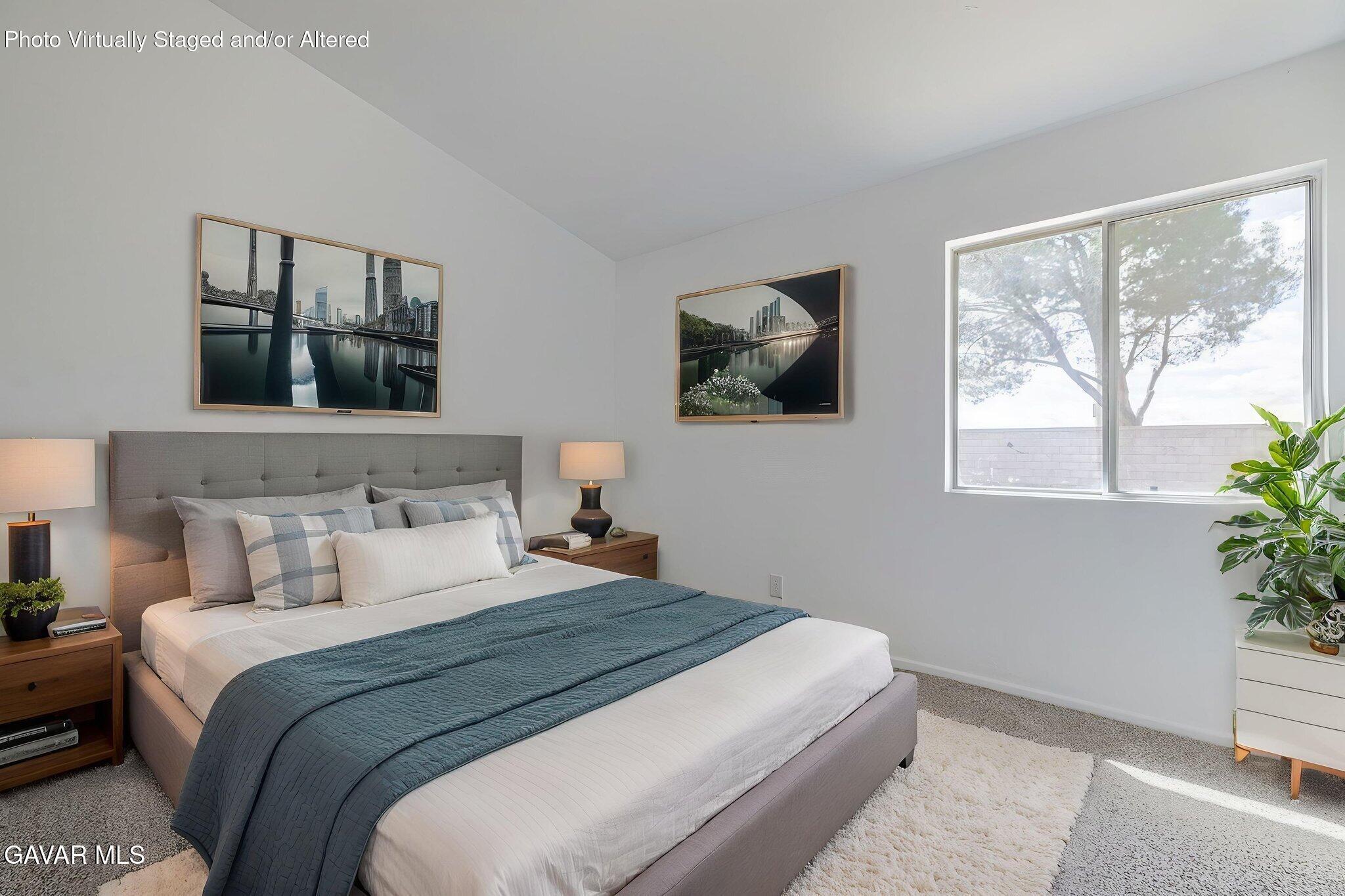 2340 Lightcap Street Lancaster, CA 93535 - Photo 25 of 40 a bedroom with a large bed and a window