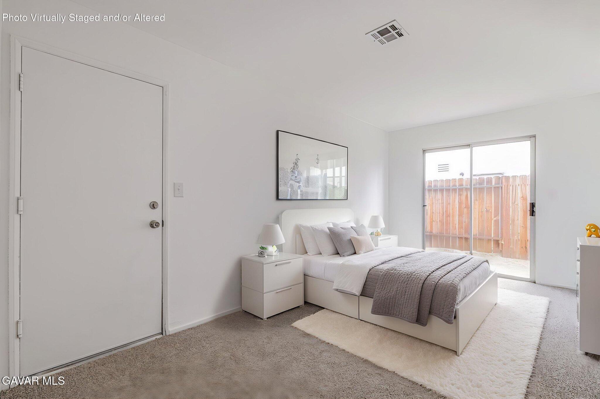 2340 Lightcap Street Lancaster, CA 93535 - Photo 31 of 40 a bedroom with a bed and a window