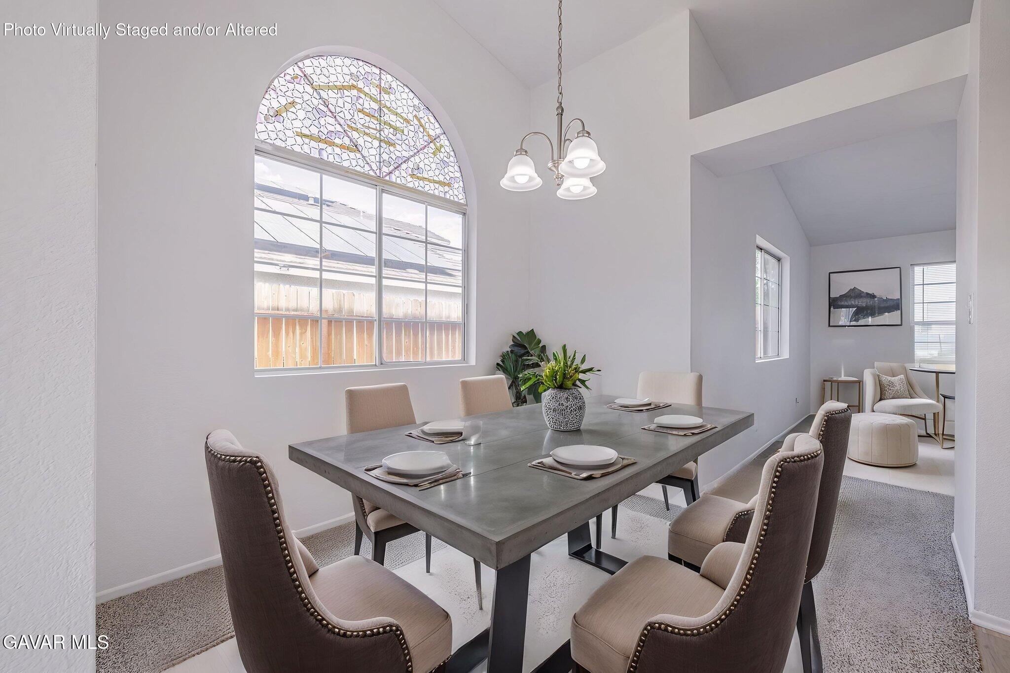 2340 Lightcap Street Lancaster, CA 93535 - Photo 9 of 40 a view of a dining room with furniture window and wooden floor