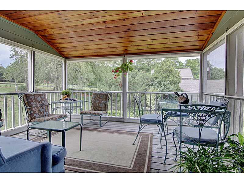 43 Serpentine Road Warren, RI 02885 - Photo 13 of 23 Porch. Screened porch on side of home with expansive views of property and Kickmuit River.