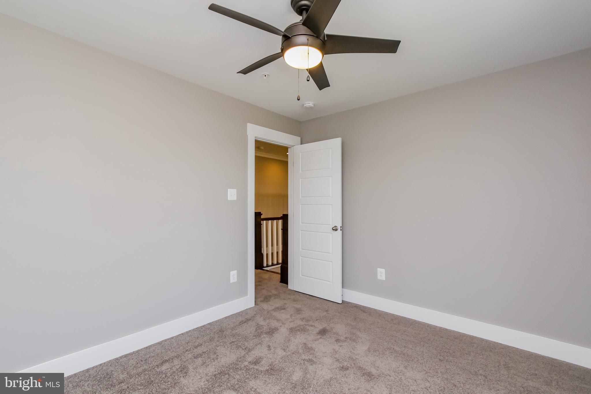 6346 Zittlestown Road Boonsboro, MD 21713 - Photo 24 of 27 an empty room with closet and a chandelier fan