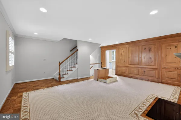 a bedroom with furniture and window