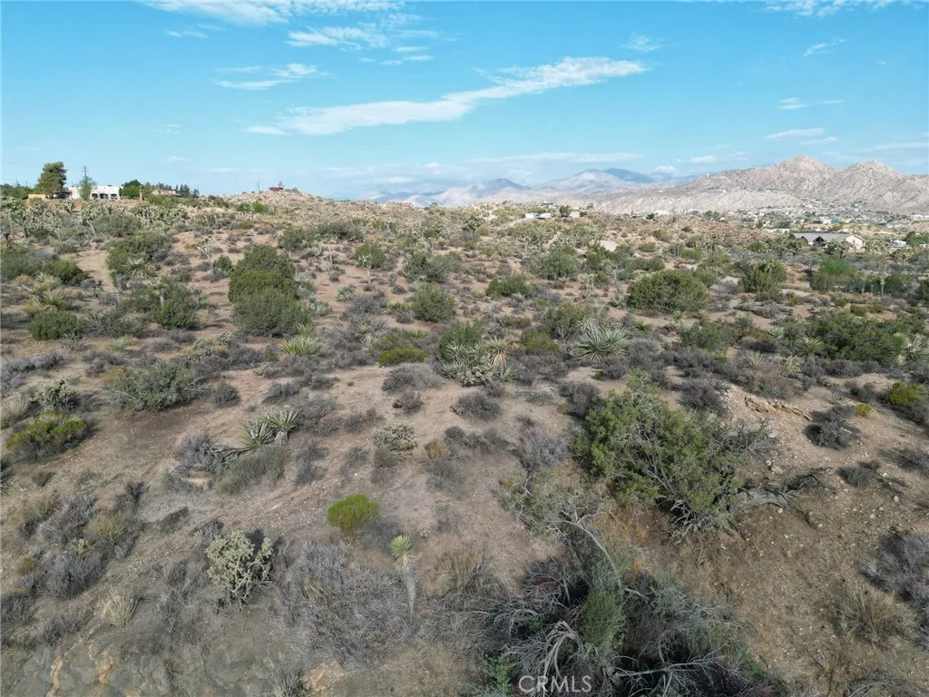 0 Kickapoo Yucca Valley Yucca Valley, CA 92284 - Photo 4 of 8 a view of a city with mountains in the background