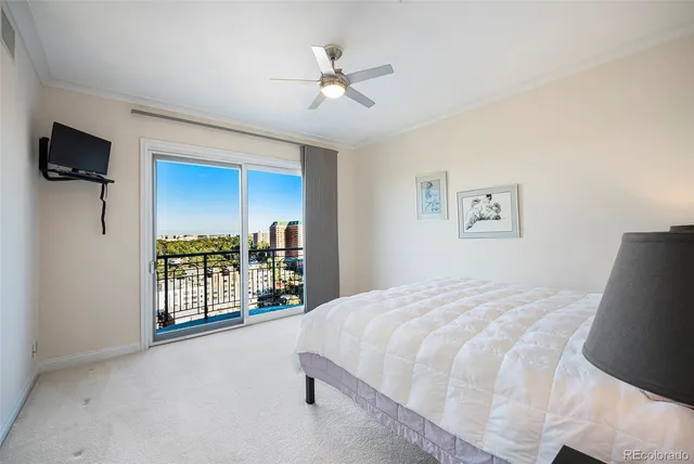 a bedroom with a large bed and a tv