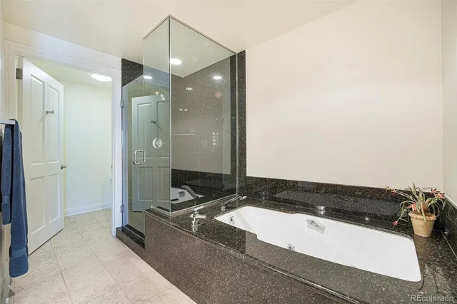 a living room with a bed and a dresser