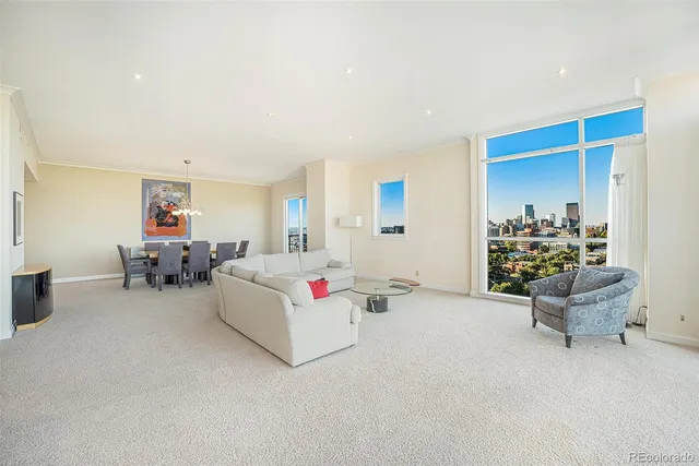 a living room with furniture and white walls