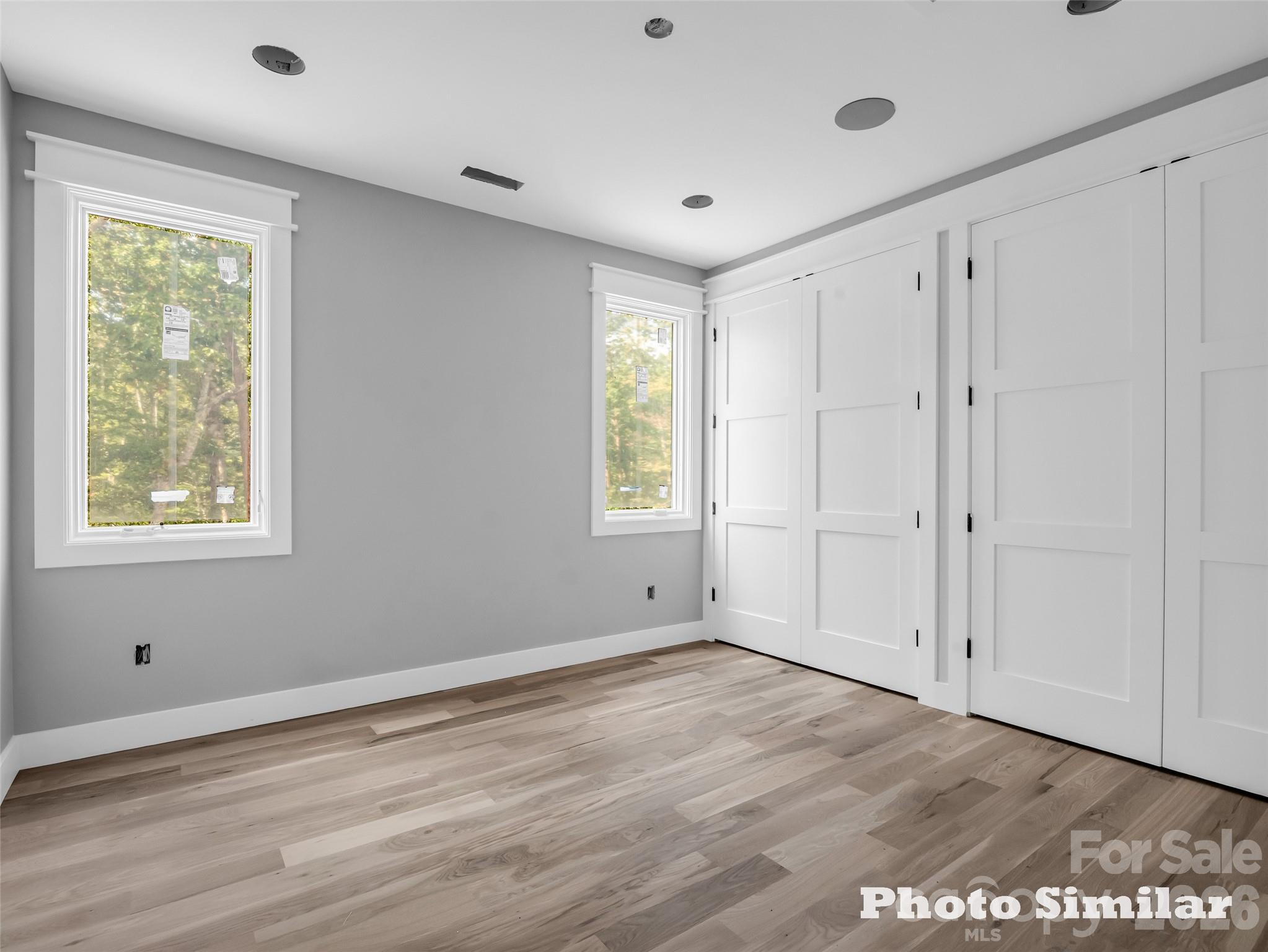 2 Jackson Ridge Ln Mill Spring Mill Spring, NC 28756 - Photo 23 of 37 a view of an empty room with a window and wooden floor