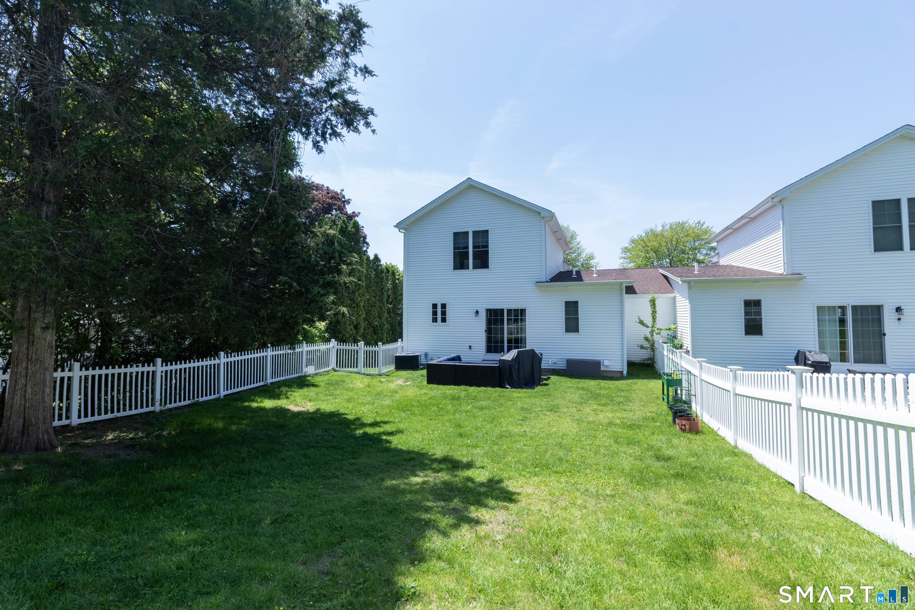 656 Bartholomew Road, Unit 656 Middletown, CT 06457 - Photo 6 of 27 a view of a house with a yard and sitting area