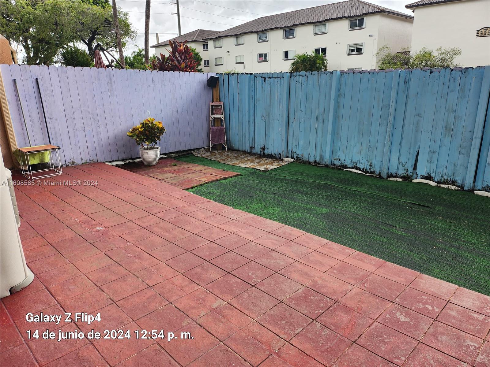 820 Southwest 105th Avenue, Unit 607 Miami, FL 33174 - Photo 19 of 22 a backyard of a house