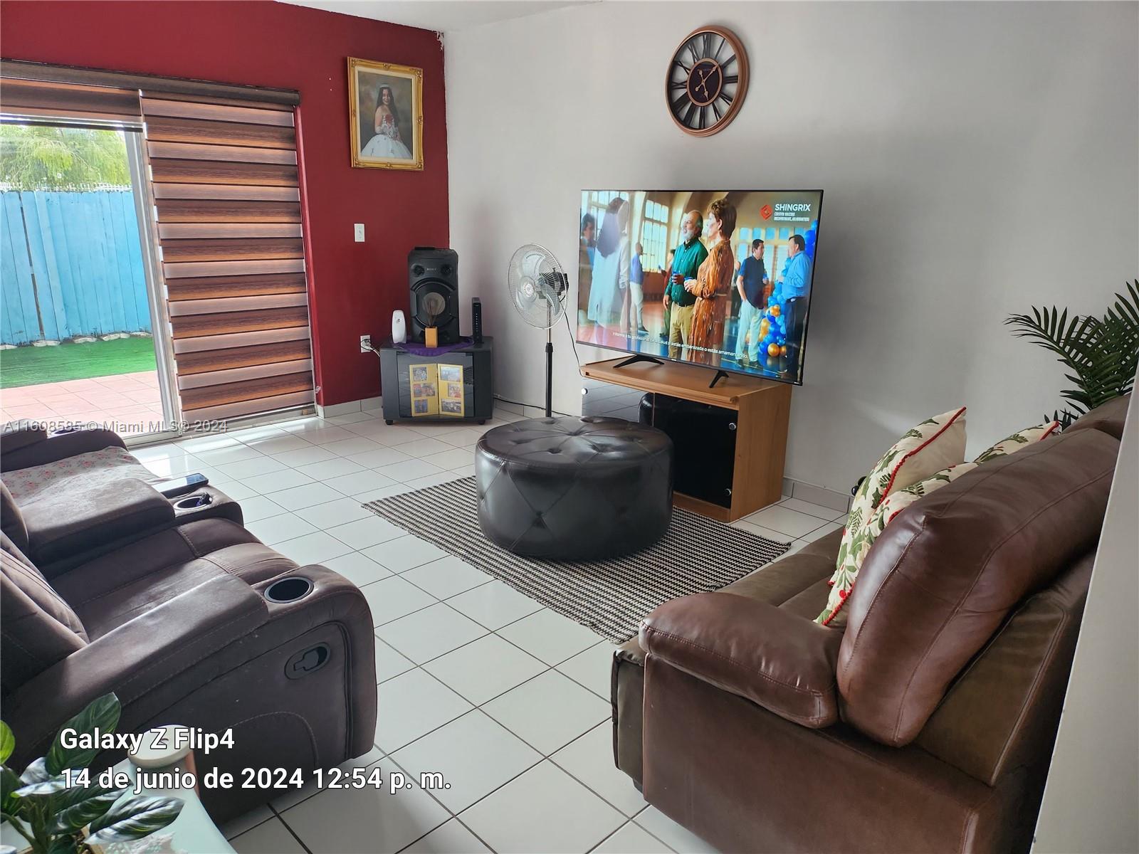 820 Southwest 105th Avenue, Unit 607 Miami, FL 33174 - Photo 2 of 22 a living room with furniture and a window