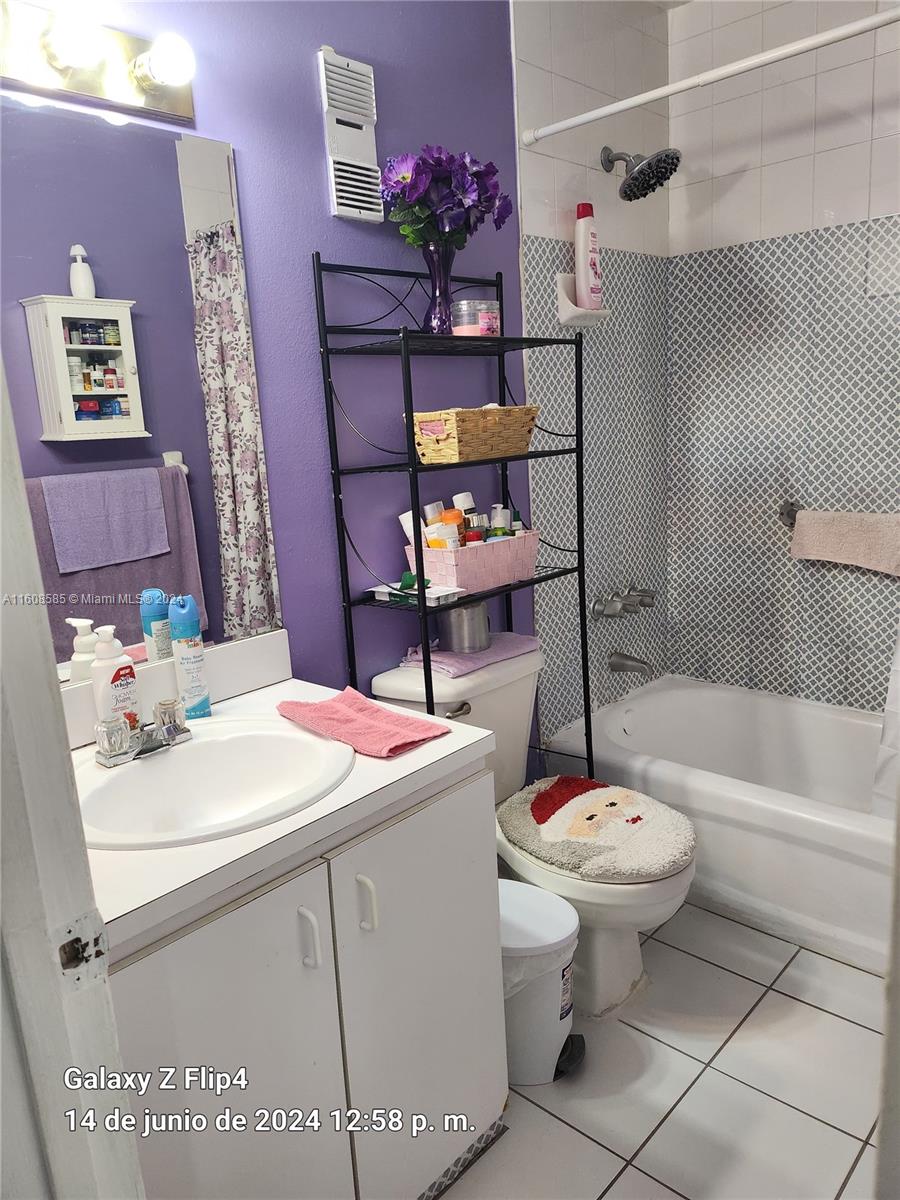820 Southwest 105th Avenue, Unit 607 Miami, FL 33174 - Photo 8 of 22 a bathroom with a sink toilet and shower