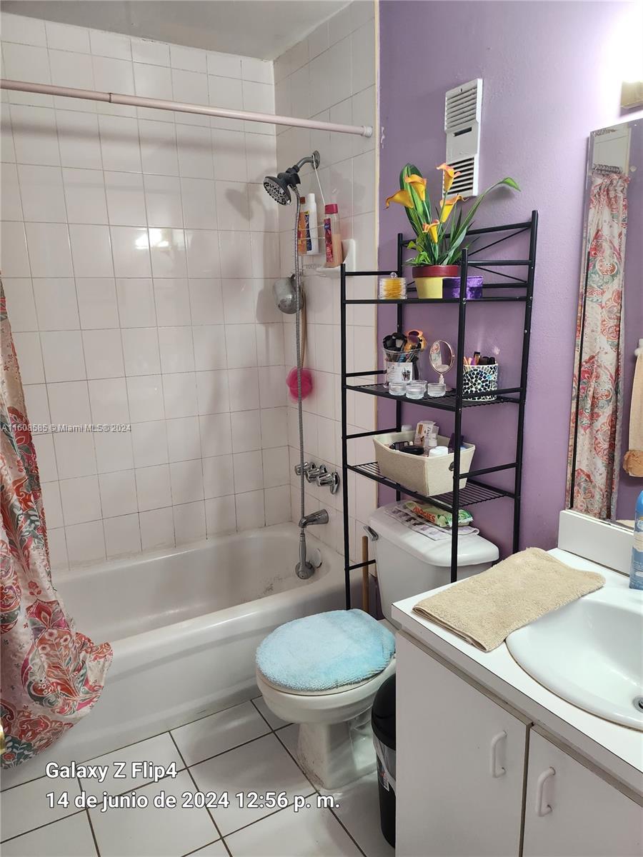 820 Southwest 105th Avenue, Unit 607 Miami, FL 33174 - Photo 9 of 22 a bathroom with a sink toilet and shower