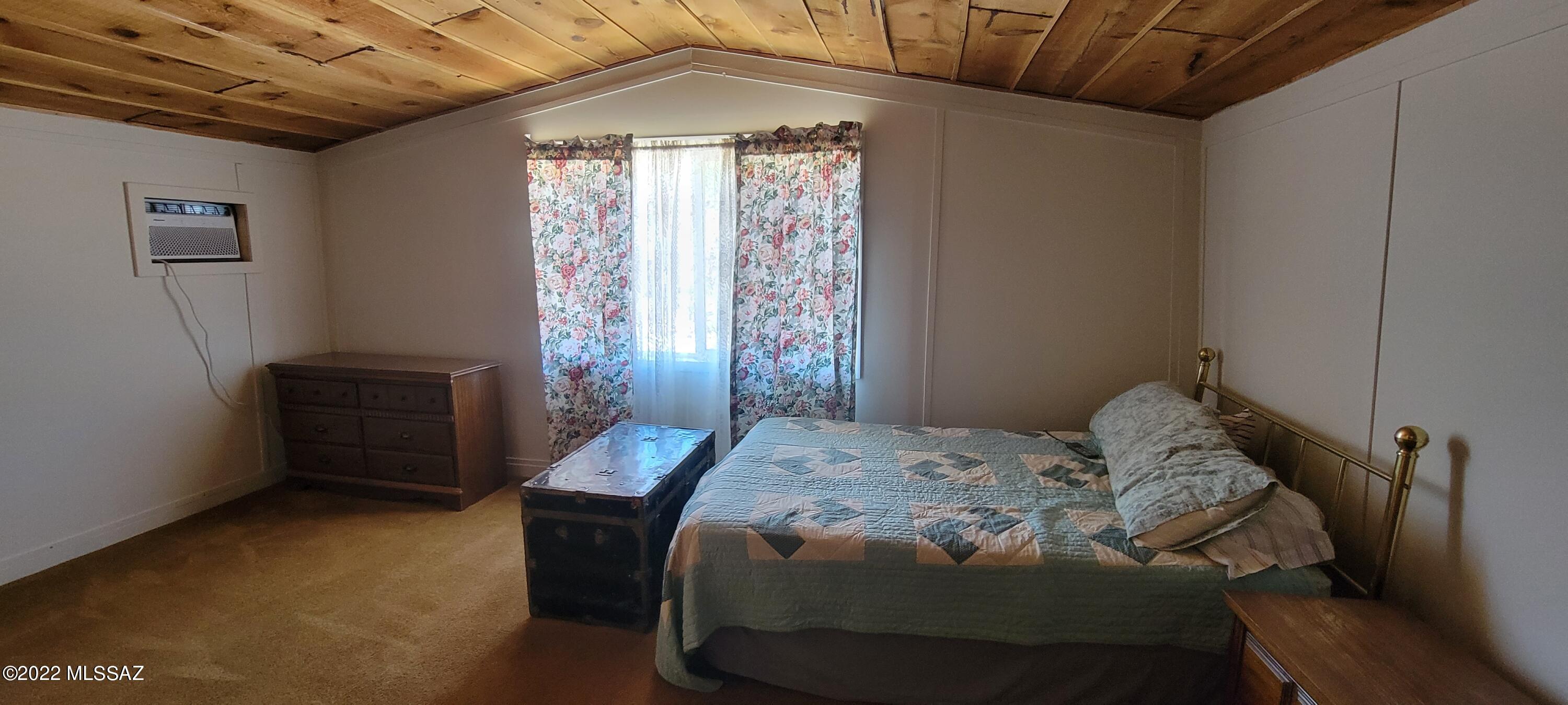 3399 Red Stag Road Pearce, AZ 85625 - Photo 30 of 47 a bedroom with a bed and a window