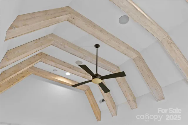 a bathroom with a bathtub and mirror