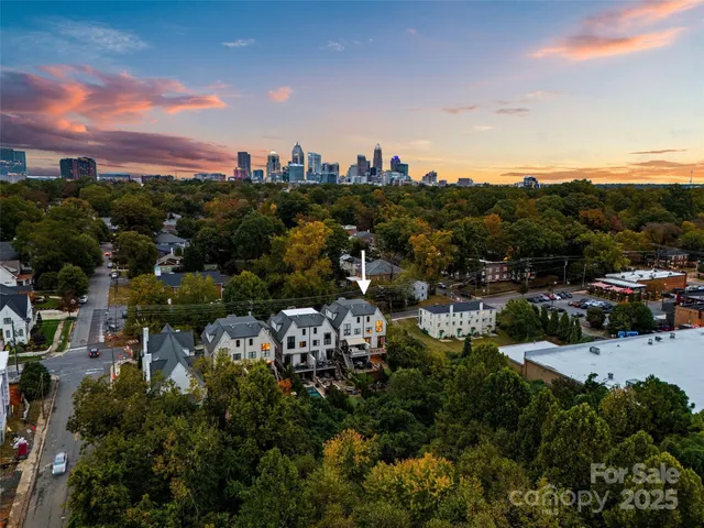 a view of a house with a flower garden