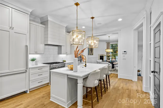 a view of a kitchen and dining table chairs