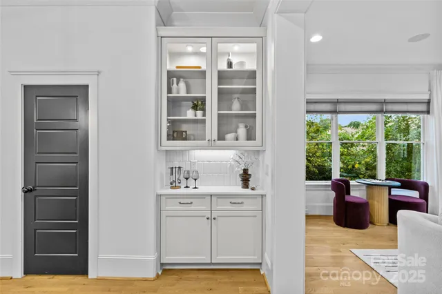 a kitchen with stainless steel appliances a stove a sink a microwave a refrigerator and cabinets