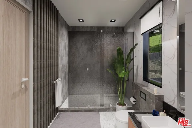 a potted plant sitting in front of a door