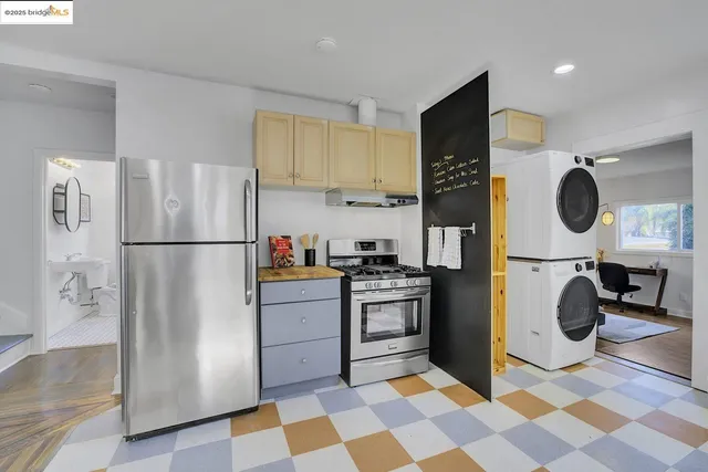 a kitchen with stainless steel appliances granite countertop a refrigerator sink and cabinets