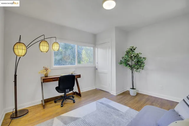 a bedroom with bed and window