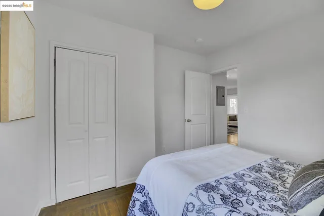 a bedroom with bed and window