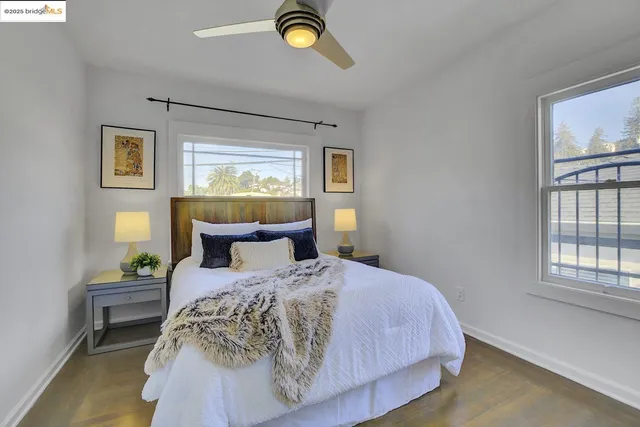 a view of a bedroom with bed and a window