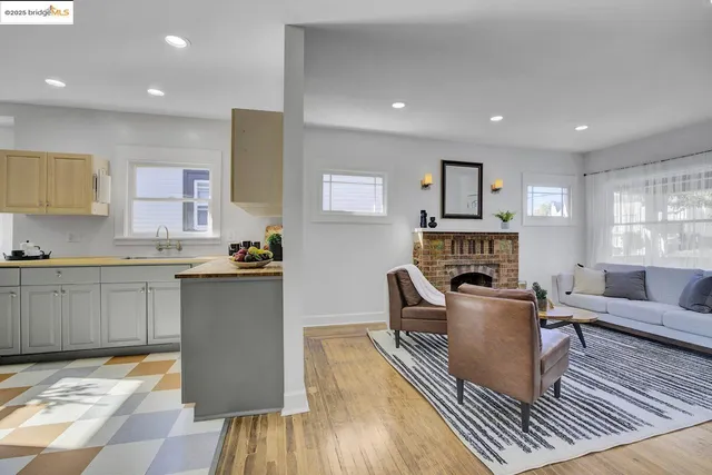 a kitchen with a checkered floor and white appliances