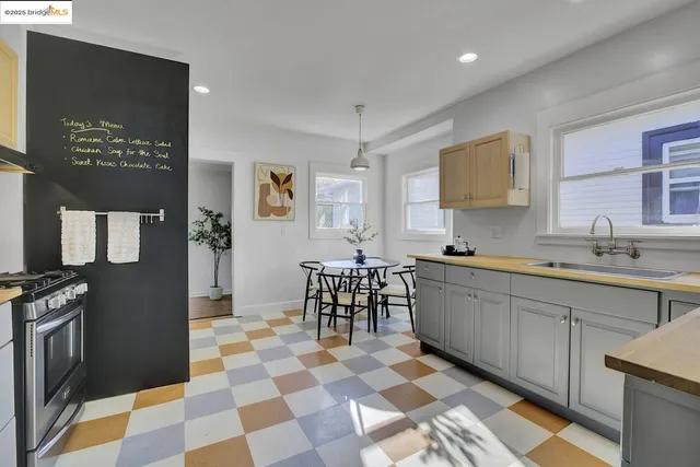 a kitchen with stainless steel appliances granite countertop a sink wooden cabinets and granite counter tops