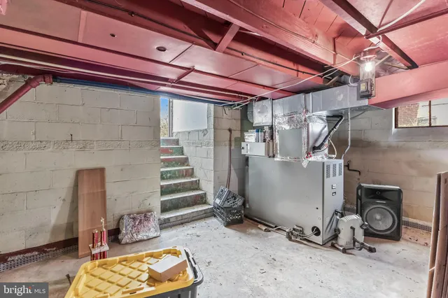 a picture of a bench in front of a wall