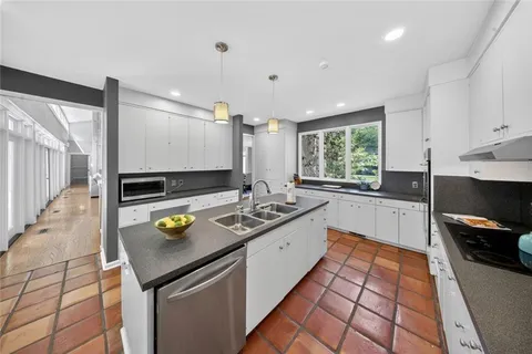 a kitchen with a table and chairs in it
