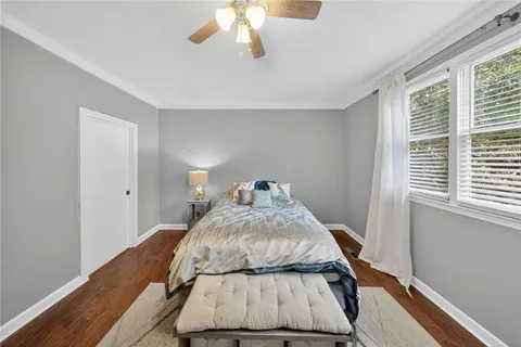 a view of a room with wooden floor