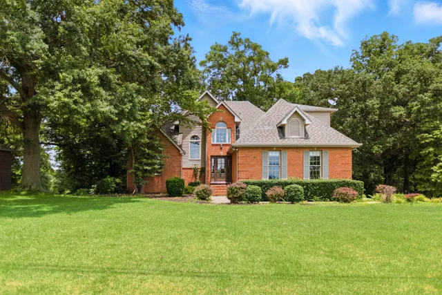 a living room with furniture or couch and a table