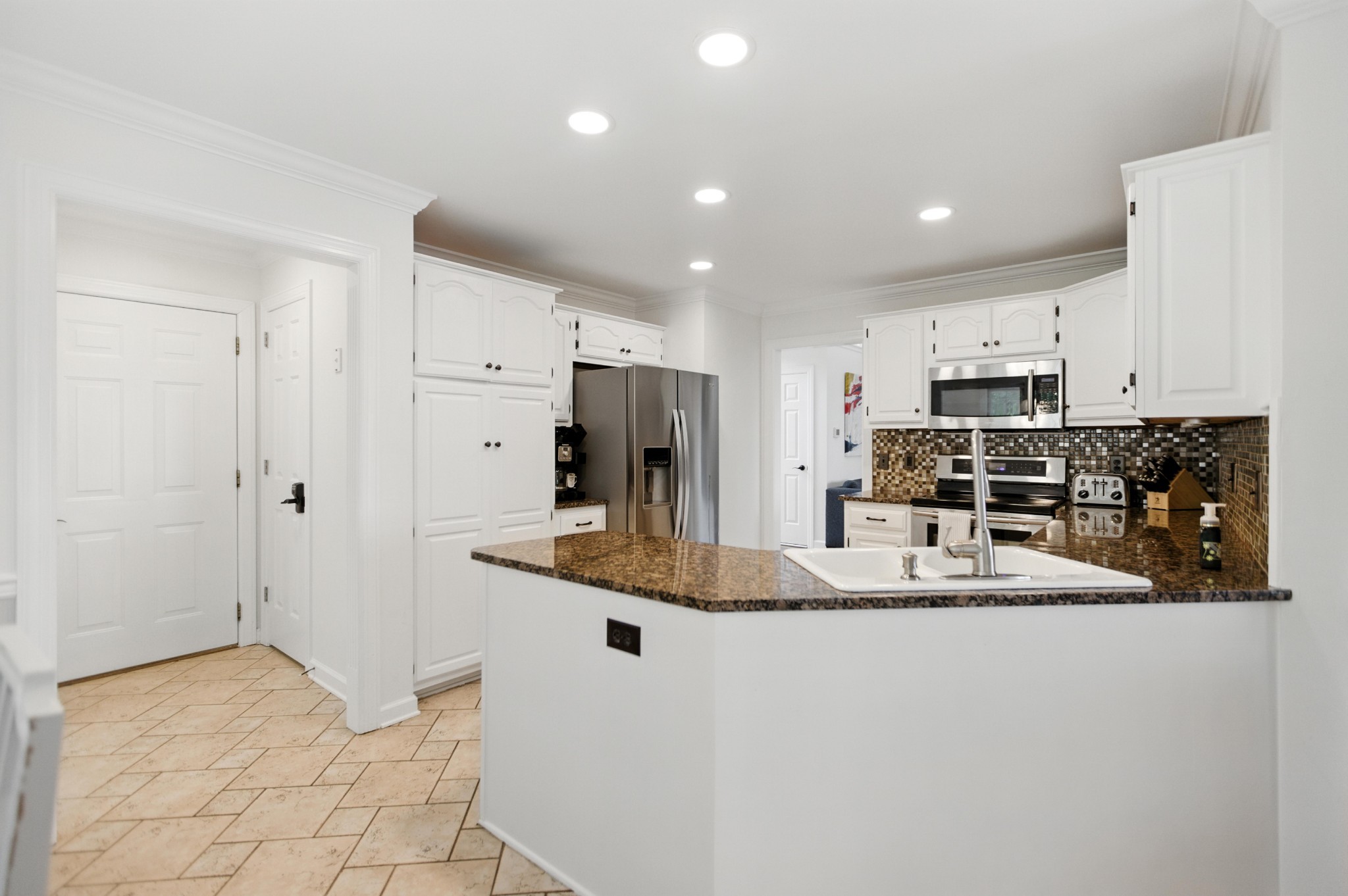 208 Loop Drive Winchester, TN 37398 - Photo 22 of 88 a kitchen with stainless steel appliances granite countertop a refrigerator and a stove top oven