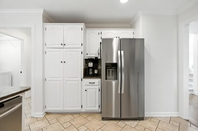 a bathroom with a double vanity sink mirror and shower