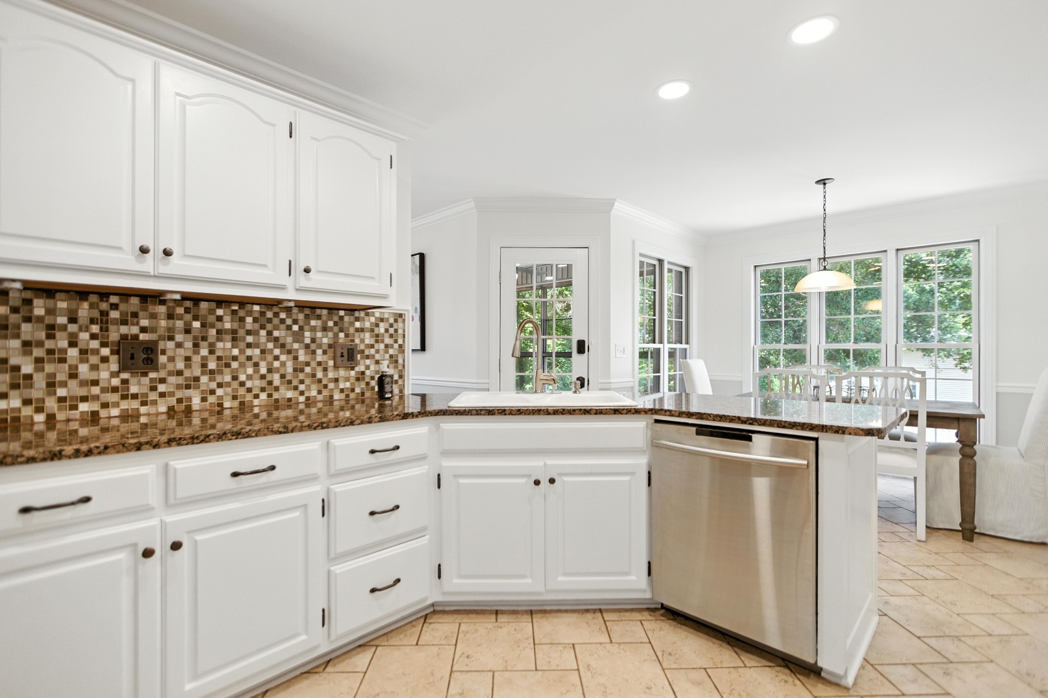208 Loop Drive Winchester, TN 37398 - Photo 27 of 88 a kitchen with granite countertop white cabinets and white appliances