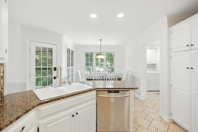 a bathroom with a bathtub and a sink