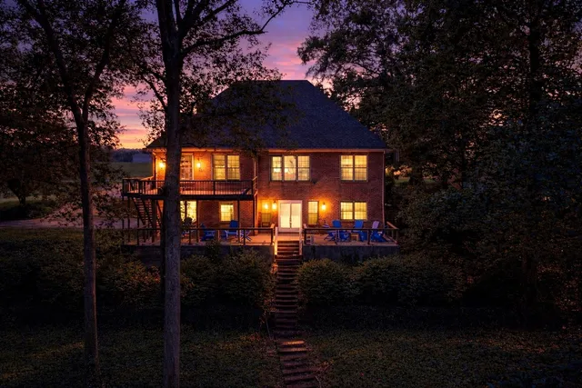 a view of a lake with a house in the background