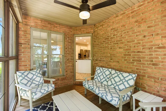 a bedroom with two beds and a chandelier
