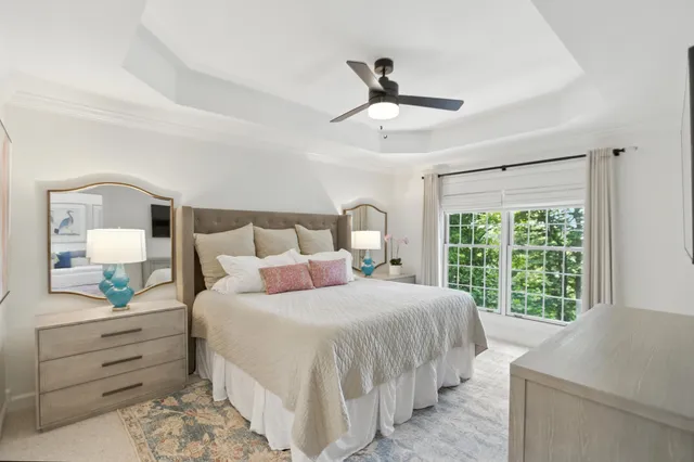 a bathroom with a double vanity sink mirror and shower
