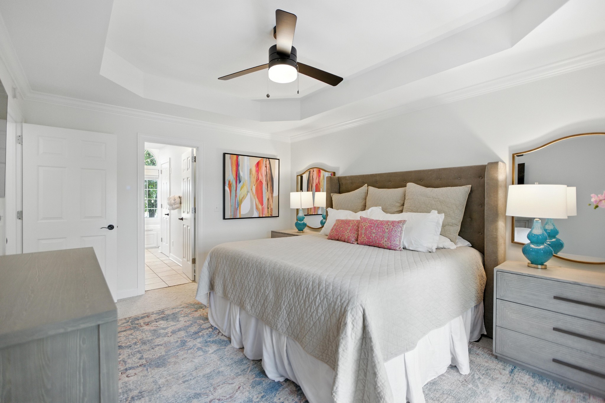 208 Loop Drive Winchester, TN 37398 - Photo 35 of 88 a bedroom with a large bed and a chandelier