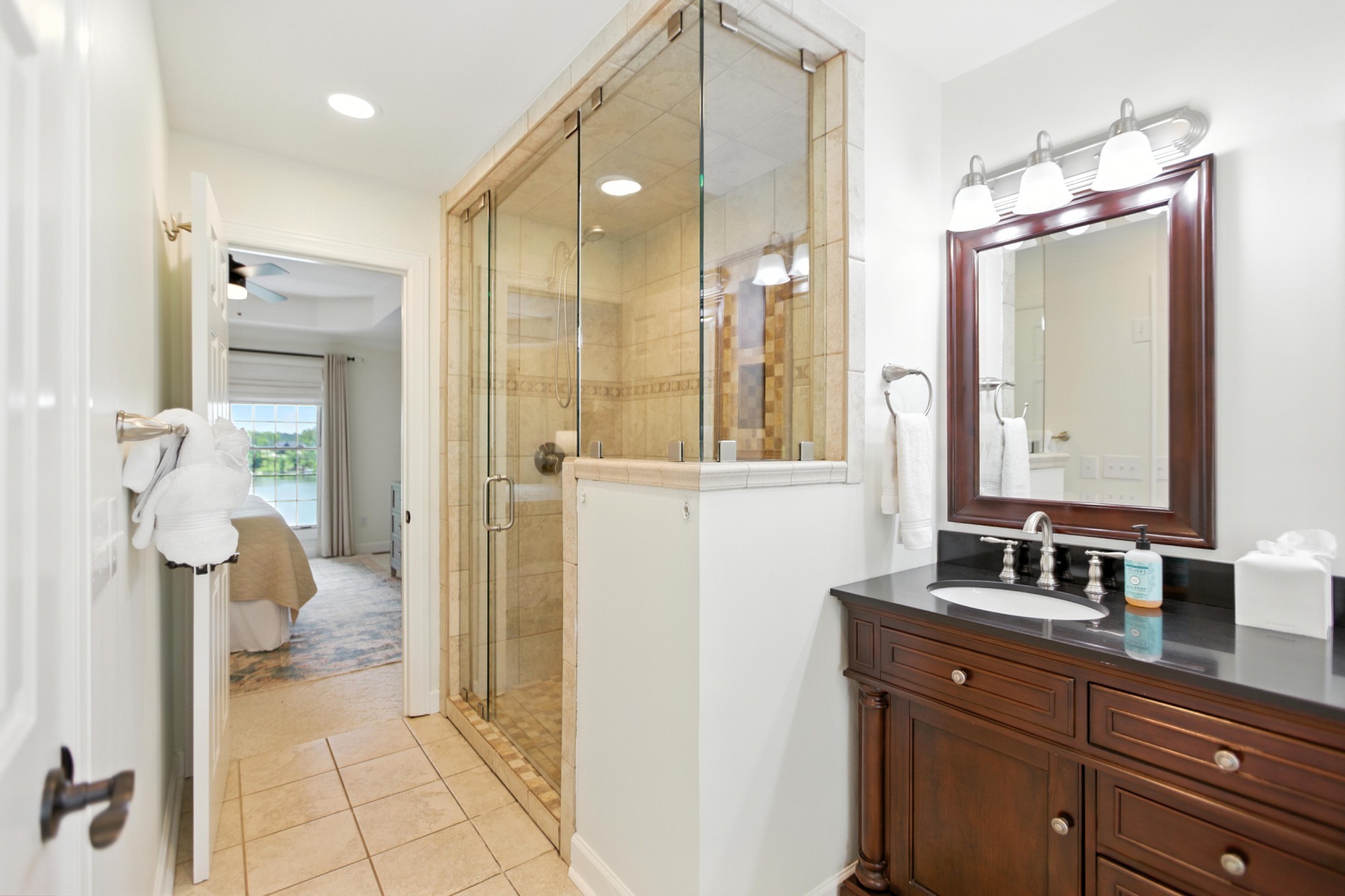 208 Loop Drive Winchester, TN 37398 - Photo 37 of 88 a bathroom with a double vanity sink mirror and shower