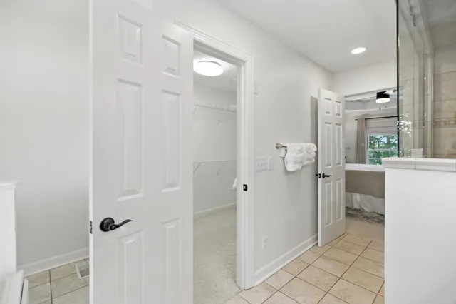 a bedroom with a bed and a night stand