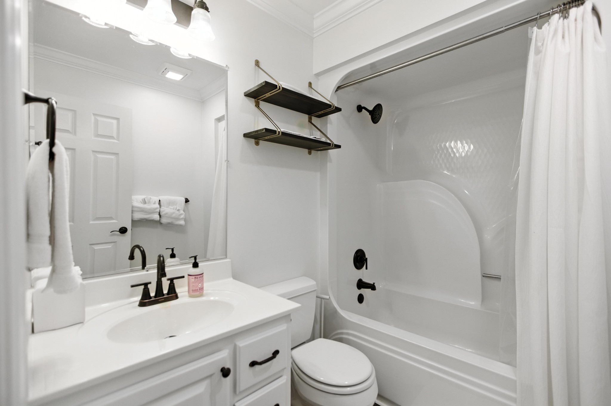 208 Loop Drive Winchester, TN 37398 - Photo 66 of 88 a bathroom with a bathtub shower sink vanity mirror and toilet