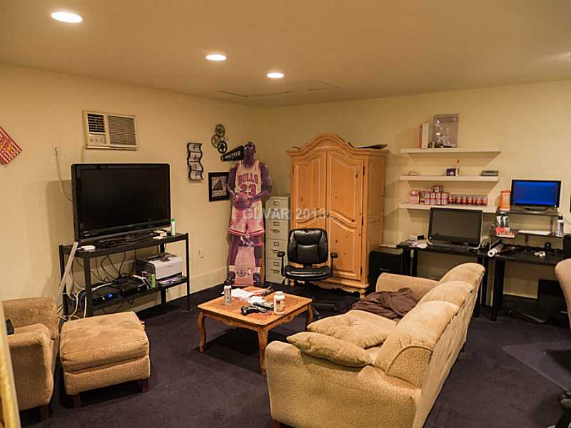 3129 South Topaz Road Las Vegas, NV 89121 - Photo 22 of 23 Property Photo. The Garage Conversion/Den Is Large & Inviting