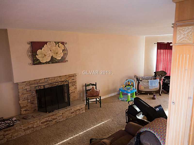 3129 South Topaz Road Las Vegas, NV 89121 - Photo 3 of 23 Property Photo. The Stone Front, Wood Burning Fireplace Graces The Living Room In This Las Vegas Classic Home