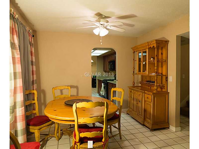 3129 South Topaz Road Las Vegas, NV 89121 - Photo 8 of 23 Property Photo. Charming Dining Area Overlooks The Sunken Living Room
