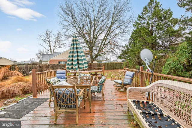 a view of a patio with iron fence